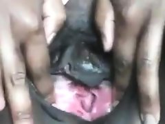 Big black woman fingering her pussy